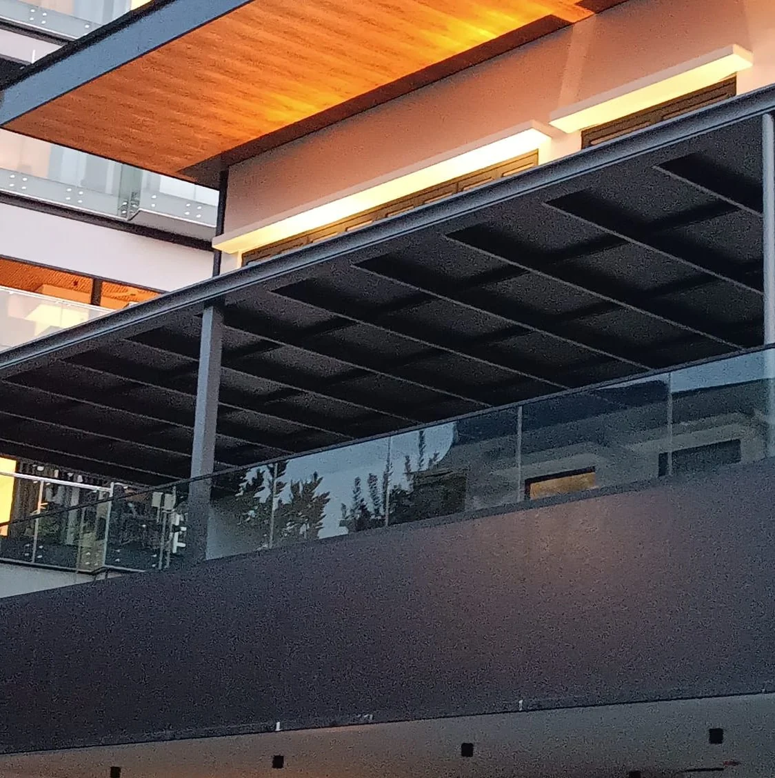Underside and timber trim, aluminium smart roof supplied by Alu-R Pro in Singapore